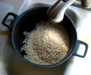 Water being added to a pot of rice